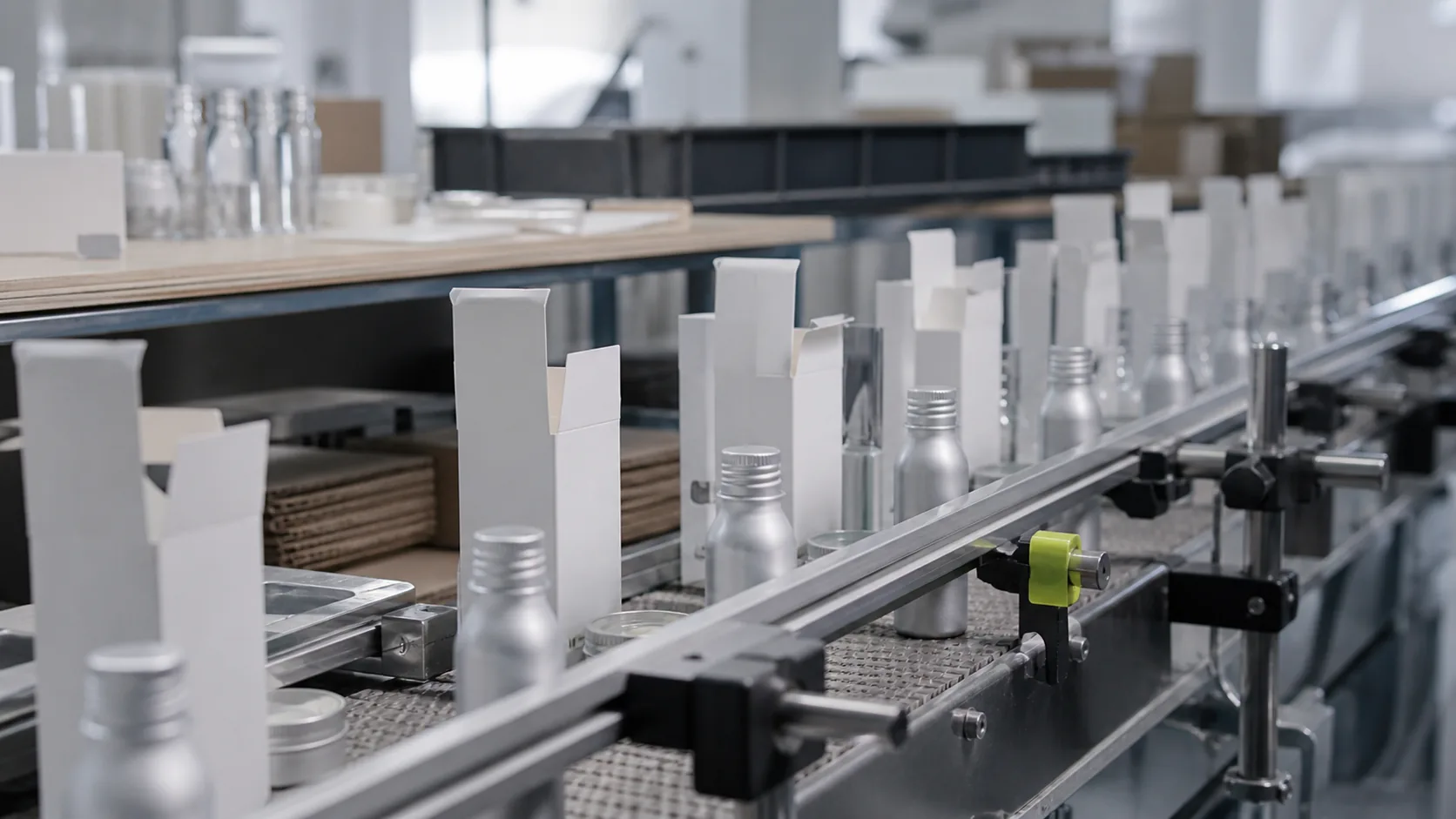 Unbranded beauty packaging components moving through a small fulfillment line